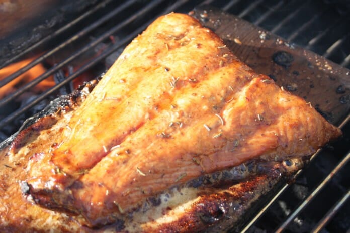 Salmon fillet, cedar plank grilled, caramelized with maple syrup and soy sauce.